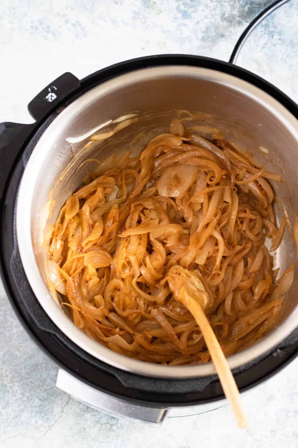 Caramelized onions inside an instant pot to make instant pot french onion soup. 