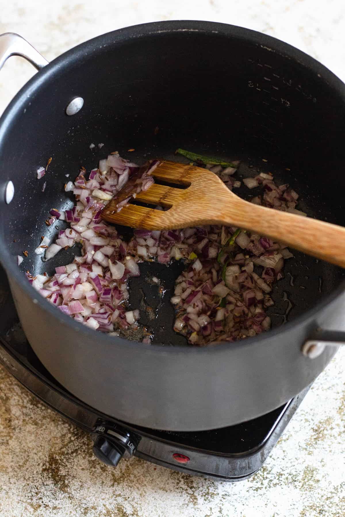 Red onions added to the spice mix. 