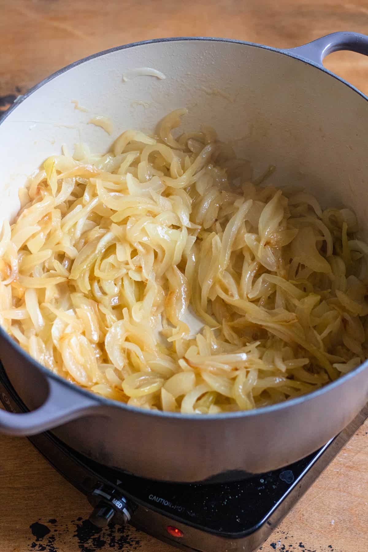 Sauteed sliced onions in a Dutch oven to make French onion soup with. 
