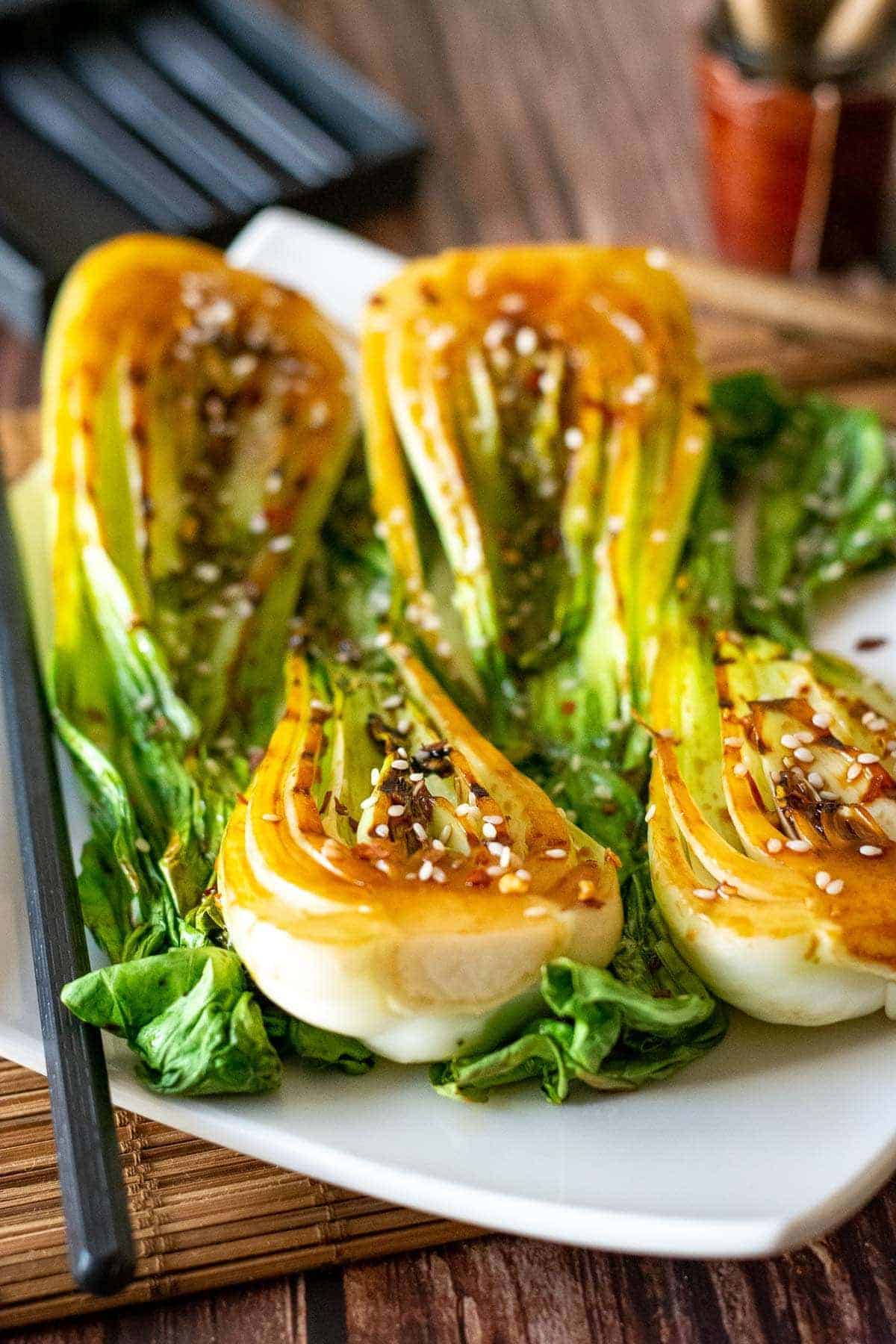 Grilled Pak Choi side dish on a plate. 