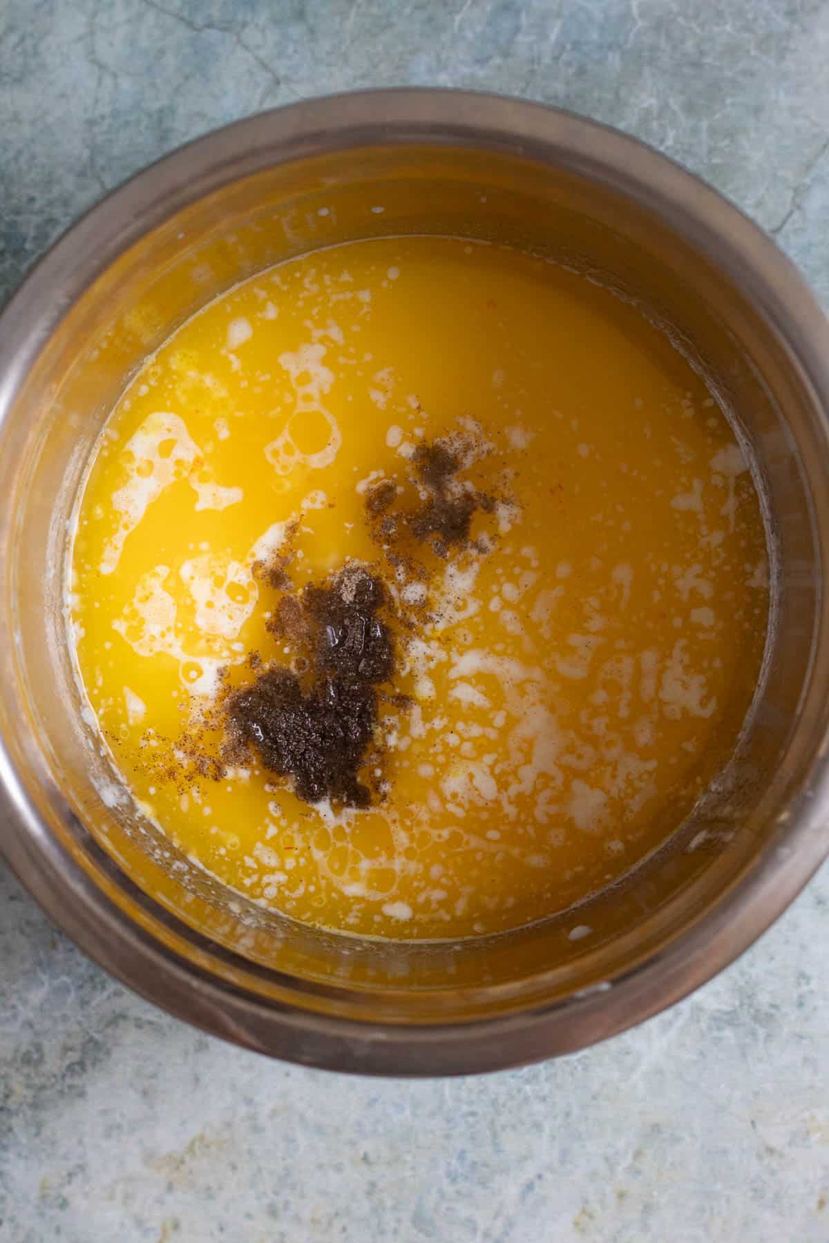 The saffron mixture combined with the melted butter and milk, then stir in the cardamom and rose water. 