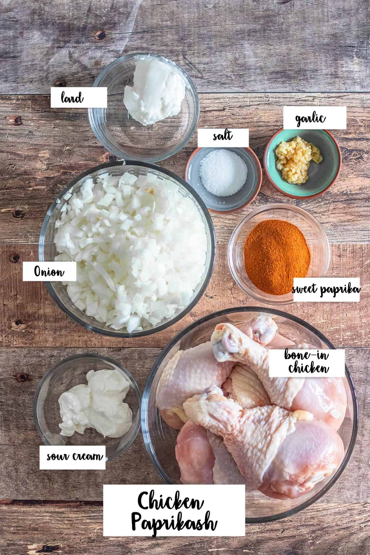 Ingredients shown are used to prepare Chicken Paprikash. 