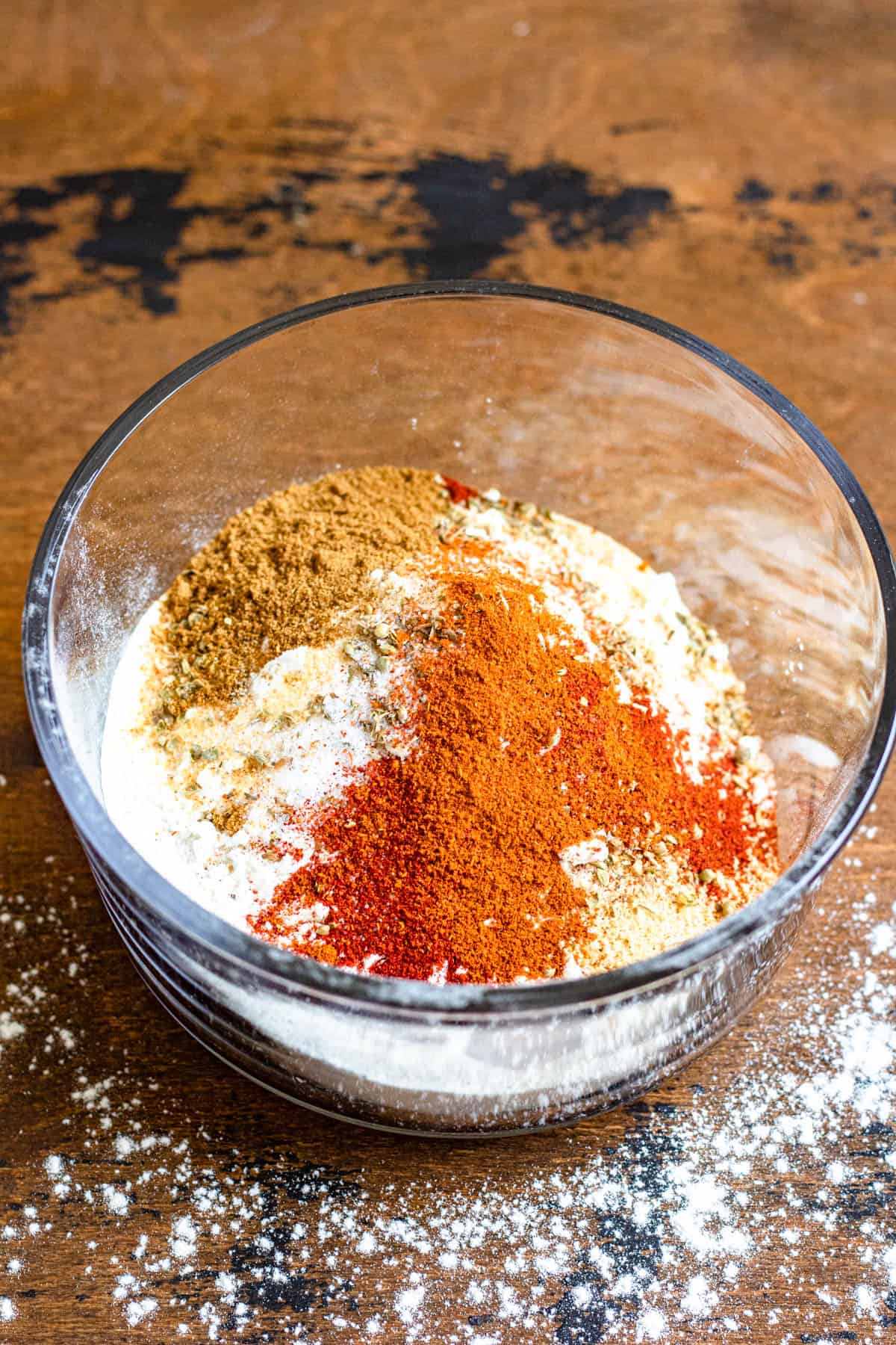 Seasonings and flour added to a small bowl. 