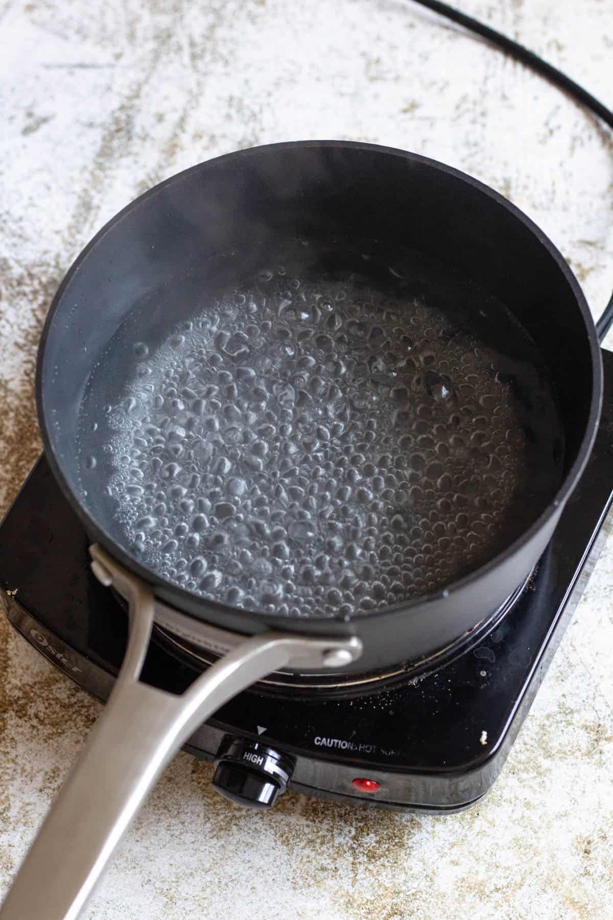 Boiling water in a saucepan. 