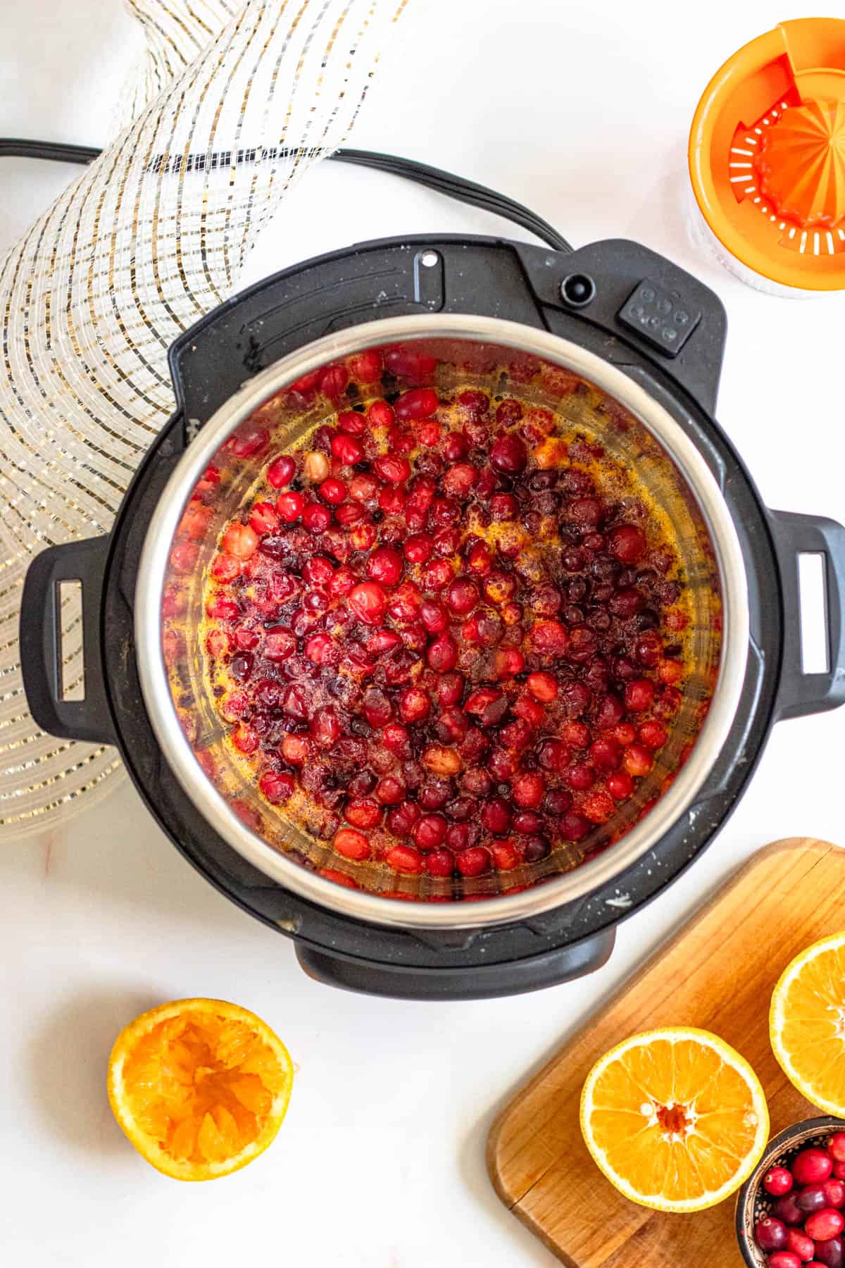 Cooking time finished on the instant pot cranberry sauce and the top removed to show the sauce before its stirred. 