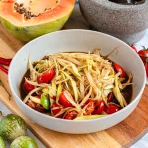 Sweet and spicy Lao papaya salad served in a bowl.