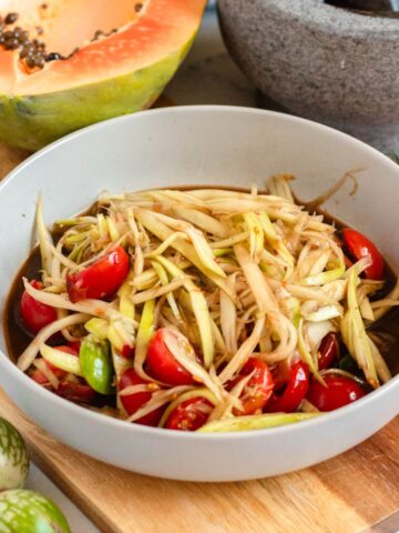 Sweet and spicy Lao papaya salad served in a bowl.