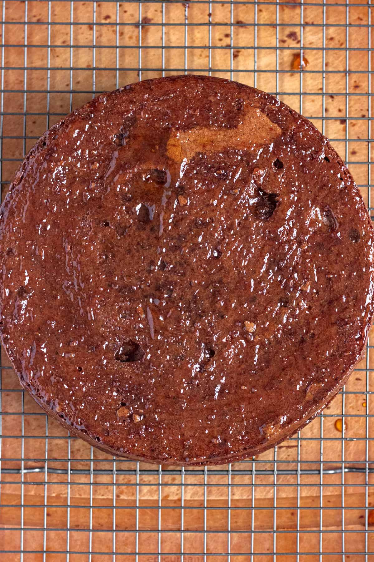 Apricot filling added to the top of one layer of the sacher torte cake. 