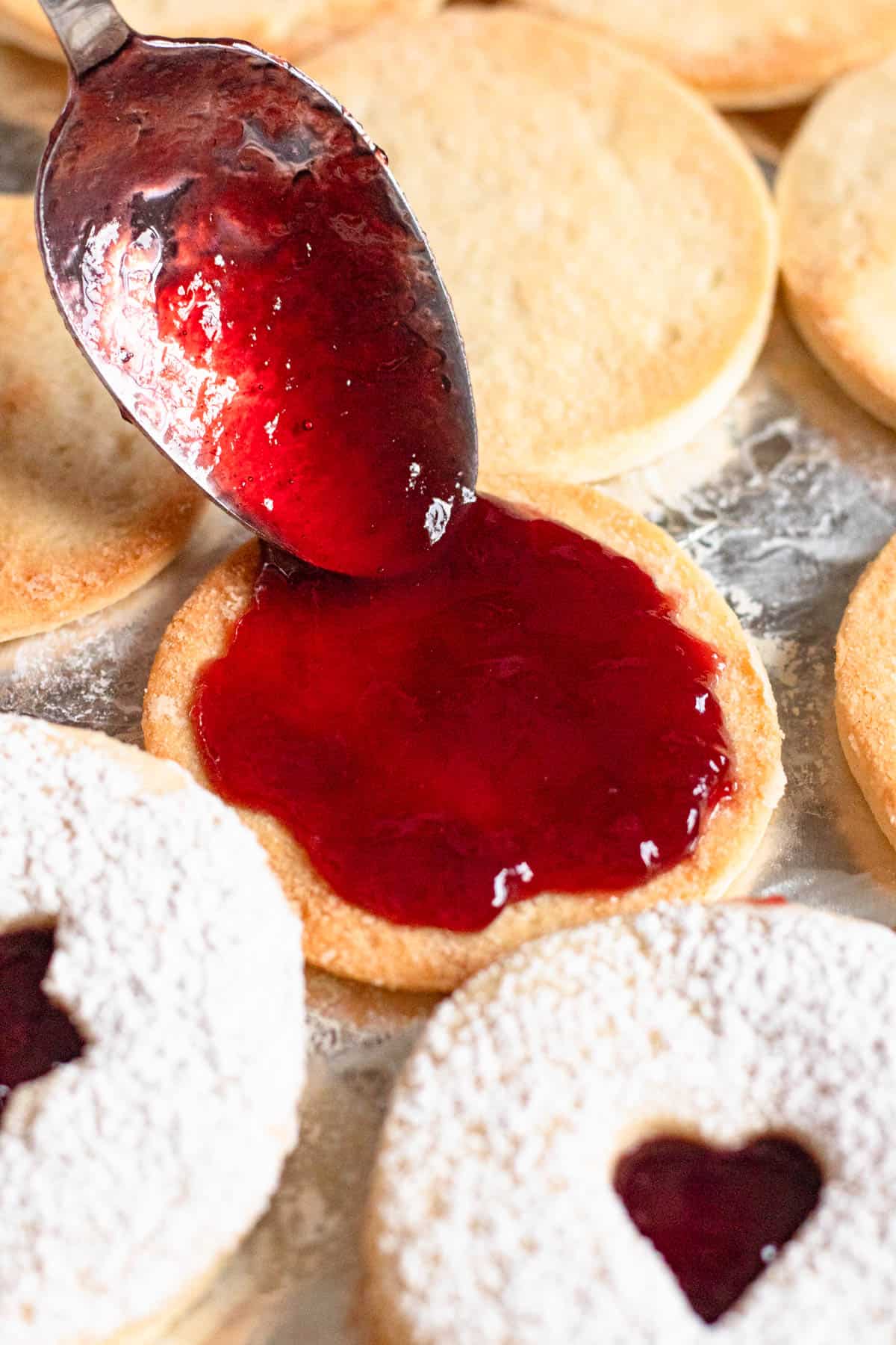 Raspberry jam added between 2 shortbread cookies to make sables. 