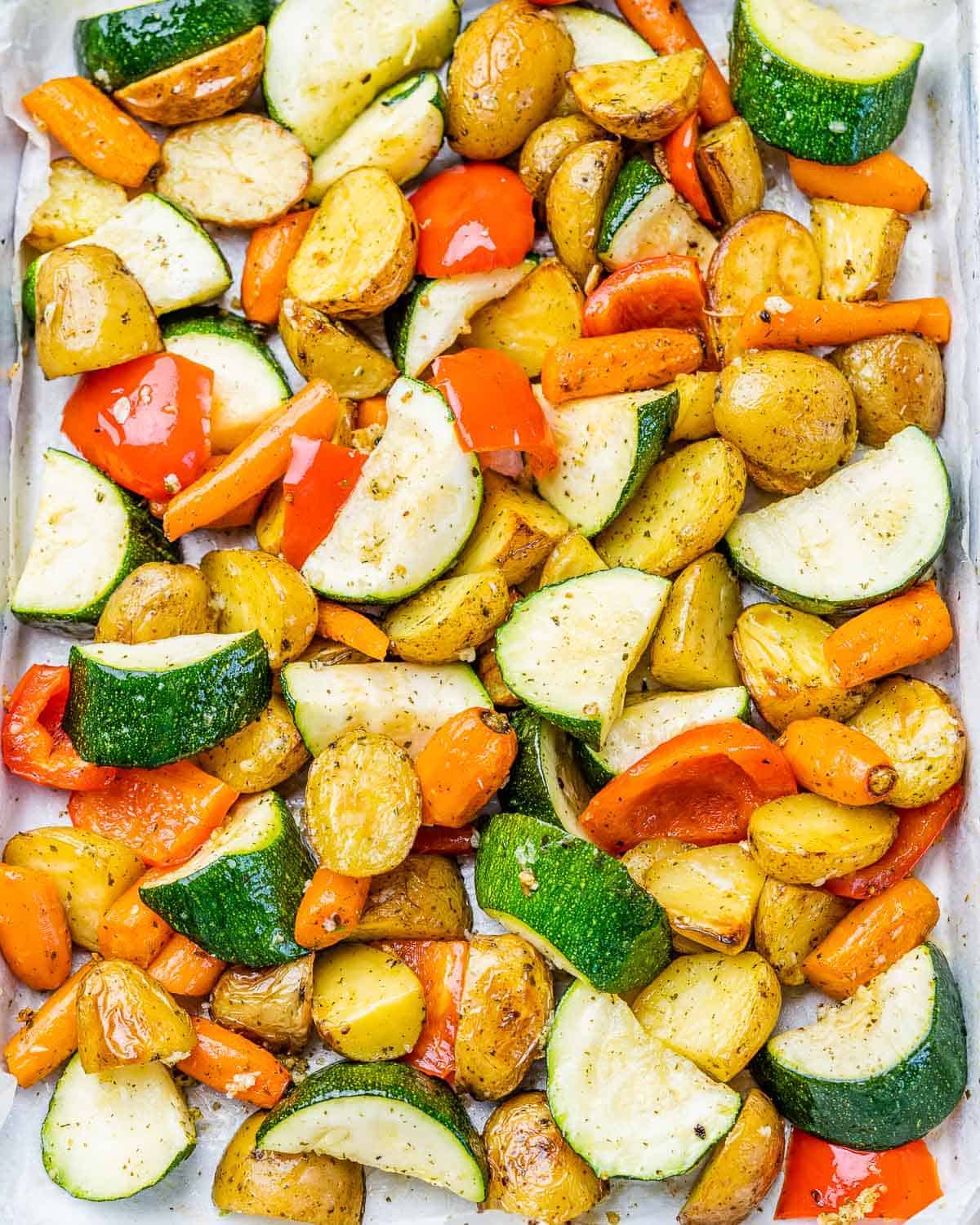 Baking sheet with garlic roasted vegetables ready to serve. 