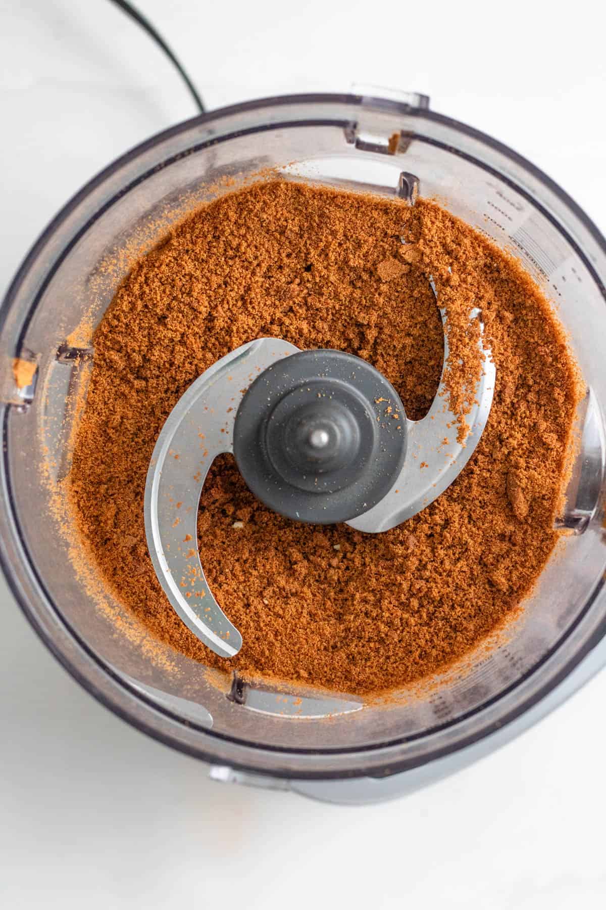 Gingersnap cookies crushed in a food processor. 