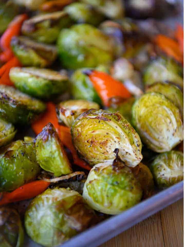 Roasted brussels sprouts with red peppers and shallots. 