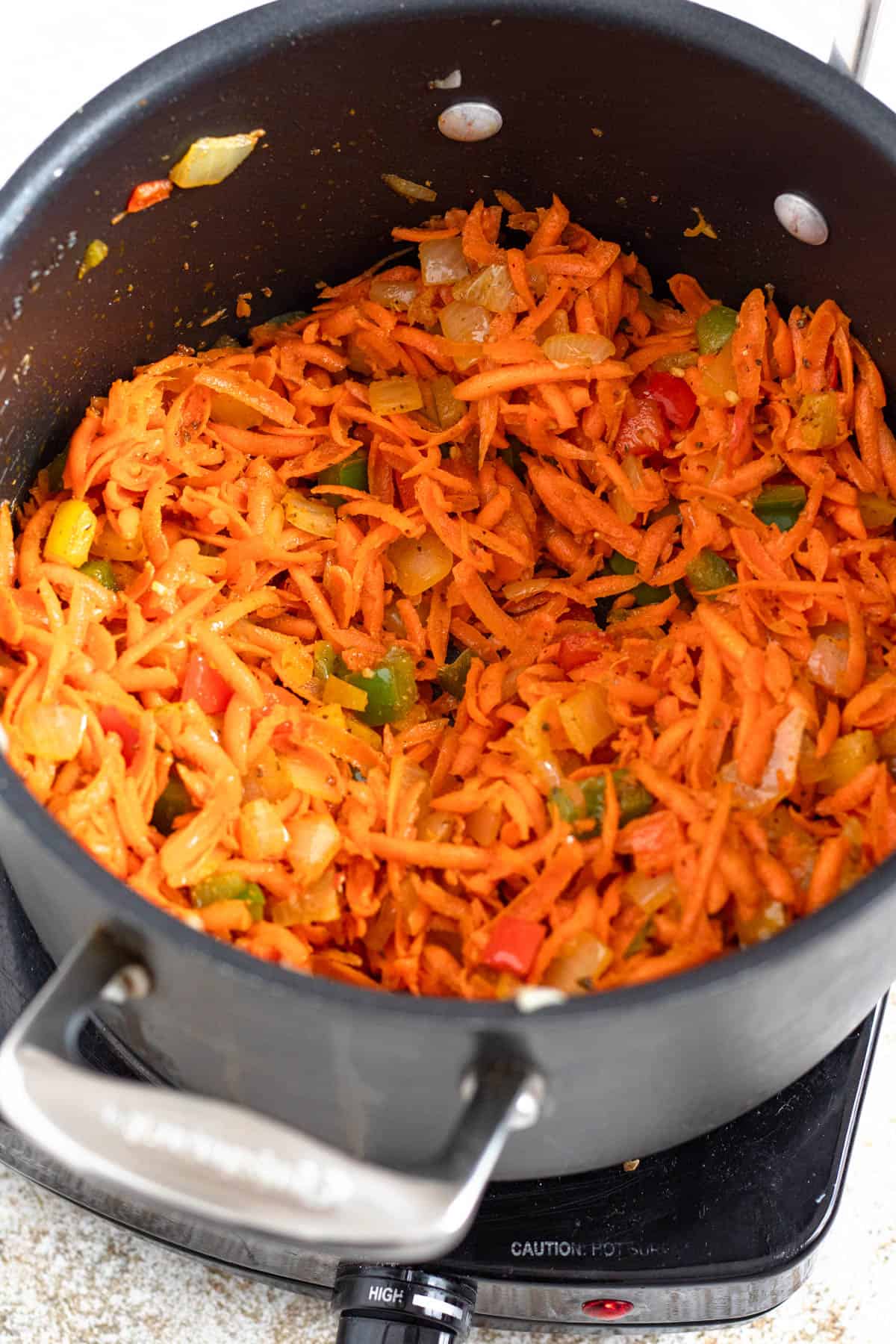 Grated carrots and a seasonings stirred into the pepper mixture. 