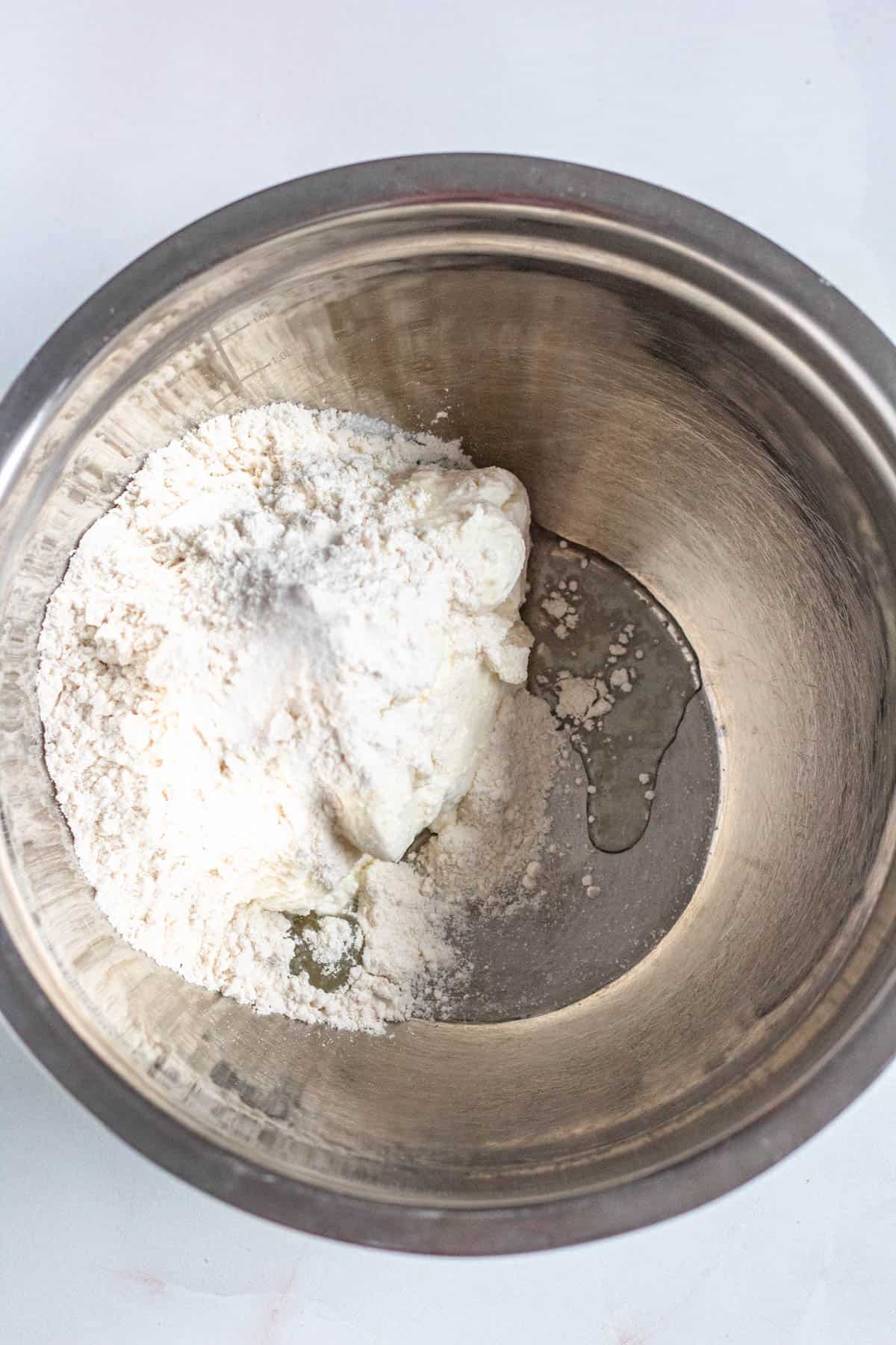 Dry ingredients in a mixing bowl for Syrniki. 