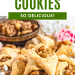 Pinterest image of a stack of walnut cookies on a parchment paper-covered cutting board with a small bowl of walnuts next to it.