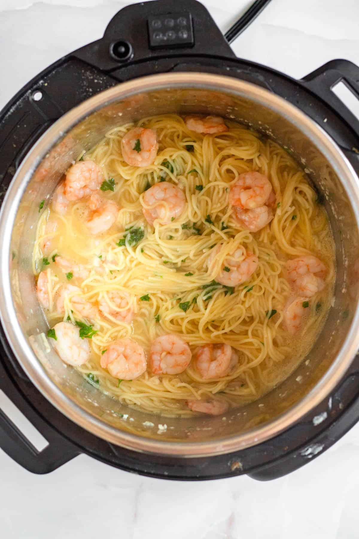 Shrimp Scampi in an Instant pot garnished with parsley.