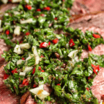 Pinterest image of the Argentinian Chimichurri on top of flank steak.