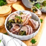 Bowl of escargot in snail shells.
