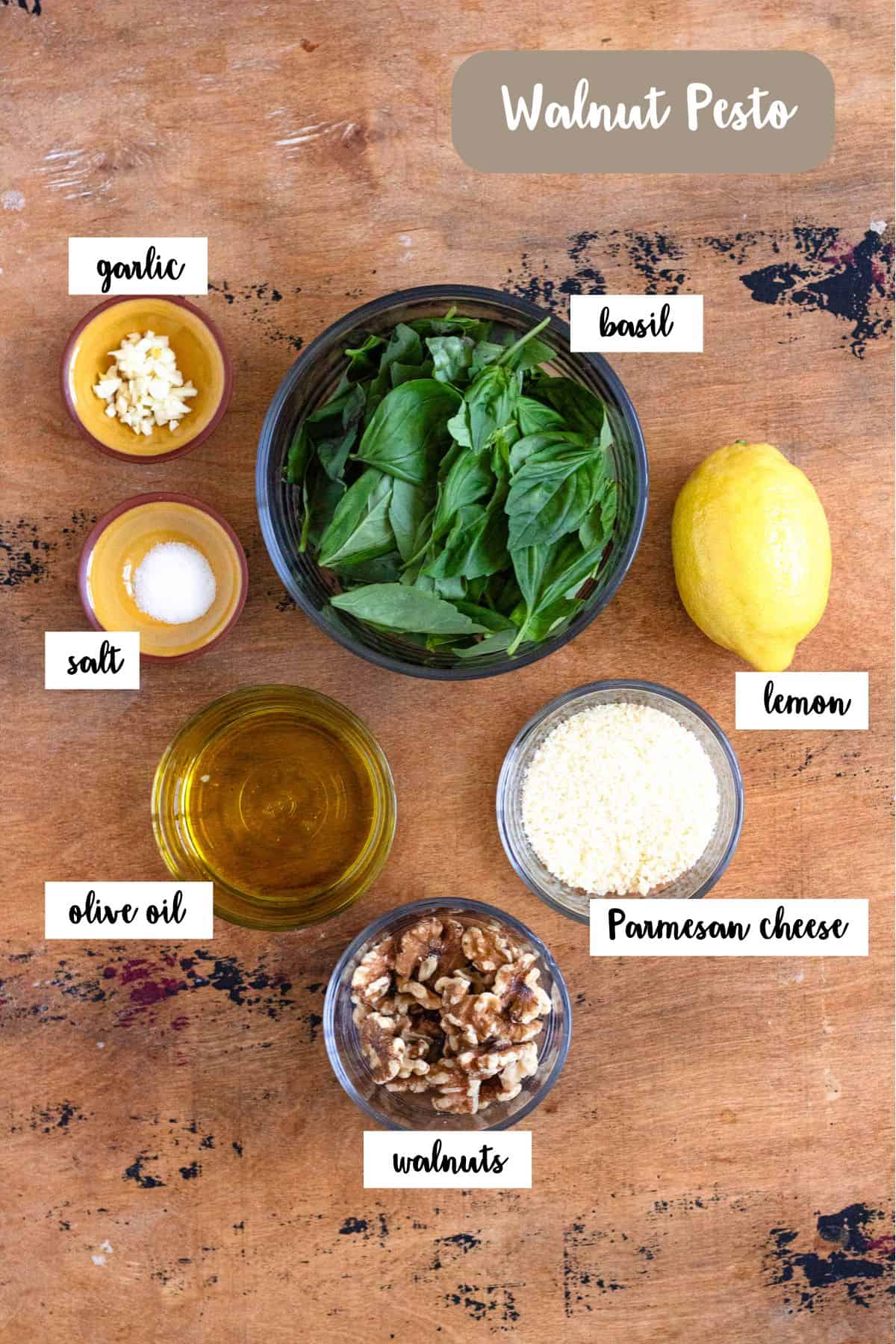 Ingredient shot of ingredients to make walnut pesto.