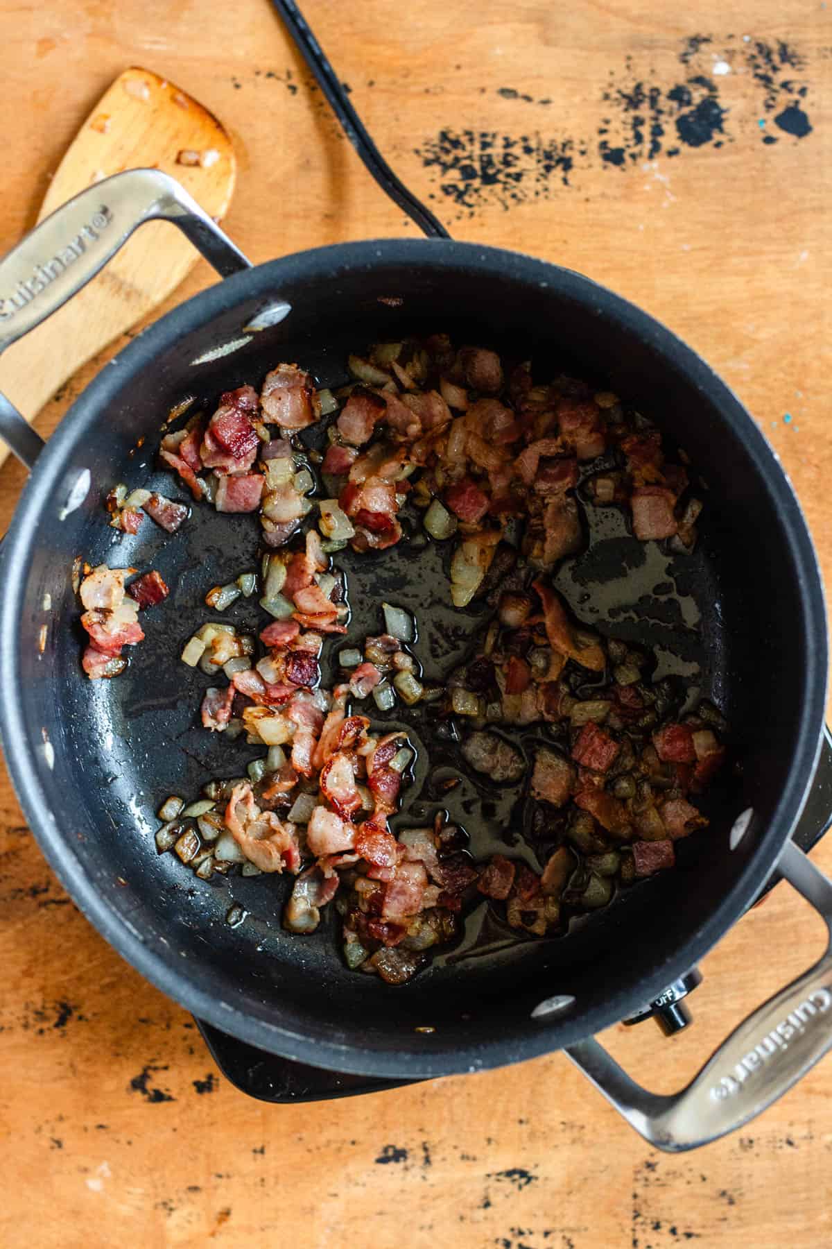Onion and bacon were cooked until the bacon turned crispy.