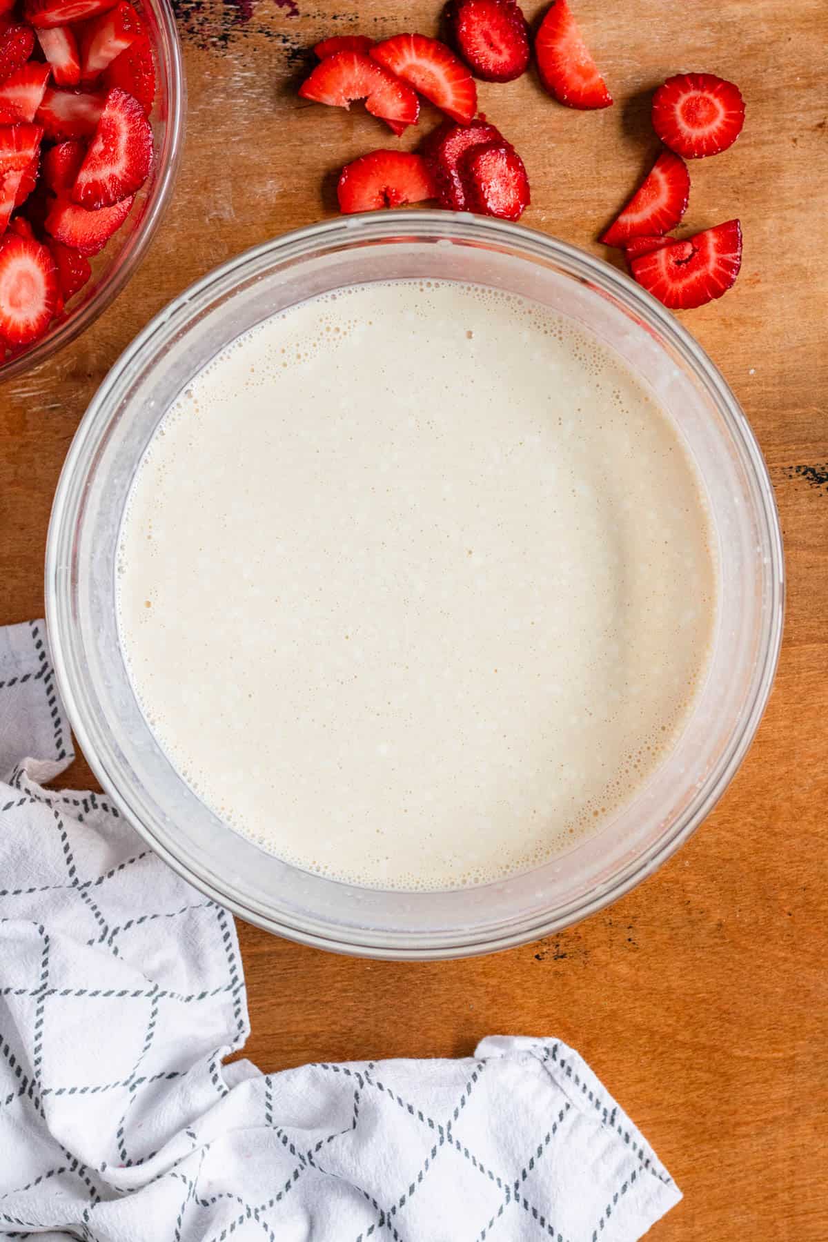 A bowl filled with crema ingredients being mixed into a smooth, creamy blend.