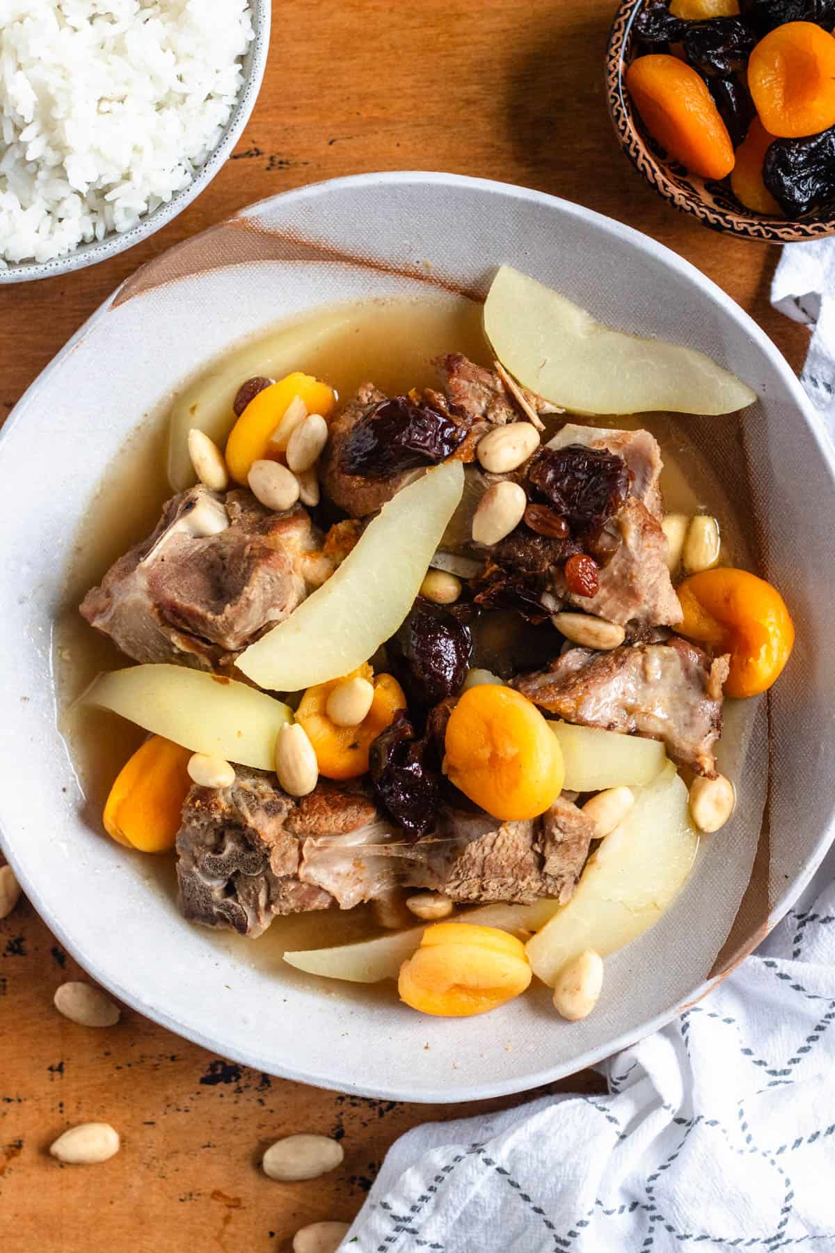 Top view of Lham Lahlou with tender meat, dried fruits, almonds, and pears.