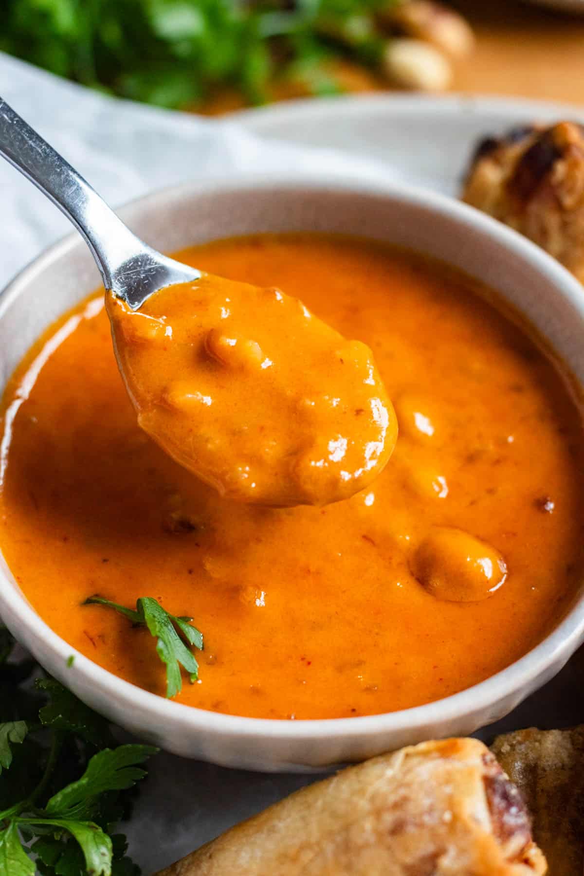 A spoonful of thick, creamy Thai Peanut Sauce.
