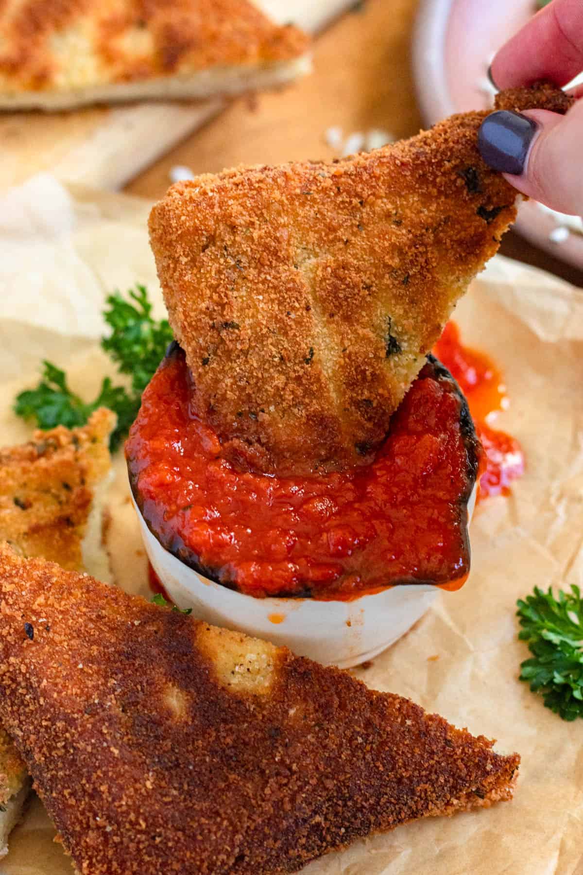 Golden, crispy Mozzarella in Carrozza dipped marinara sauce.