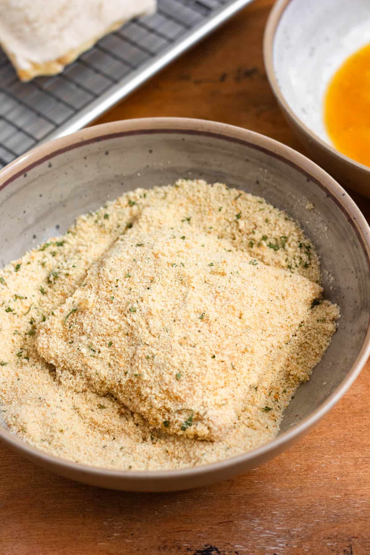 Bread with mozzarella filling coated evenly in breadcrumbs.