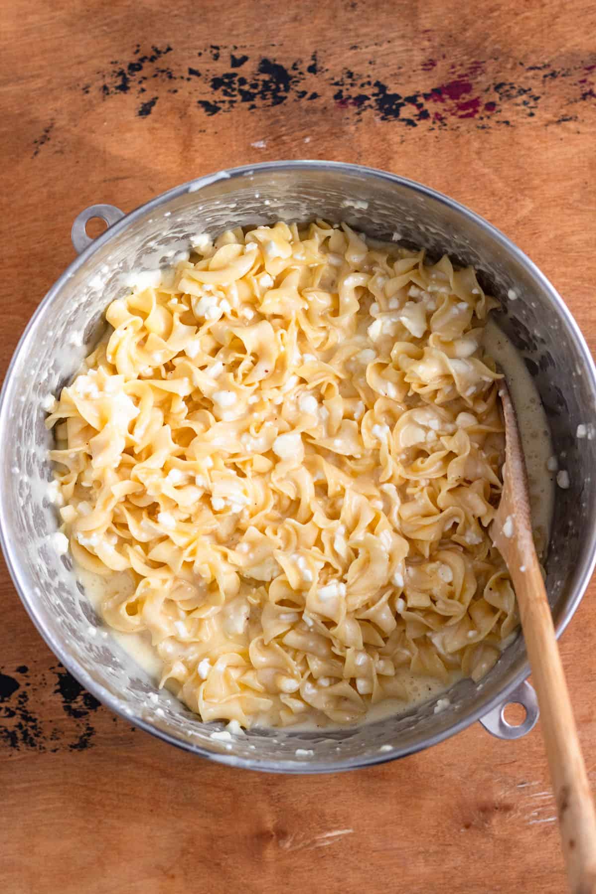 Egg noodles fully coated in a creamy custard mixture.