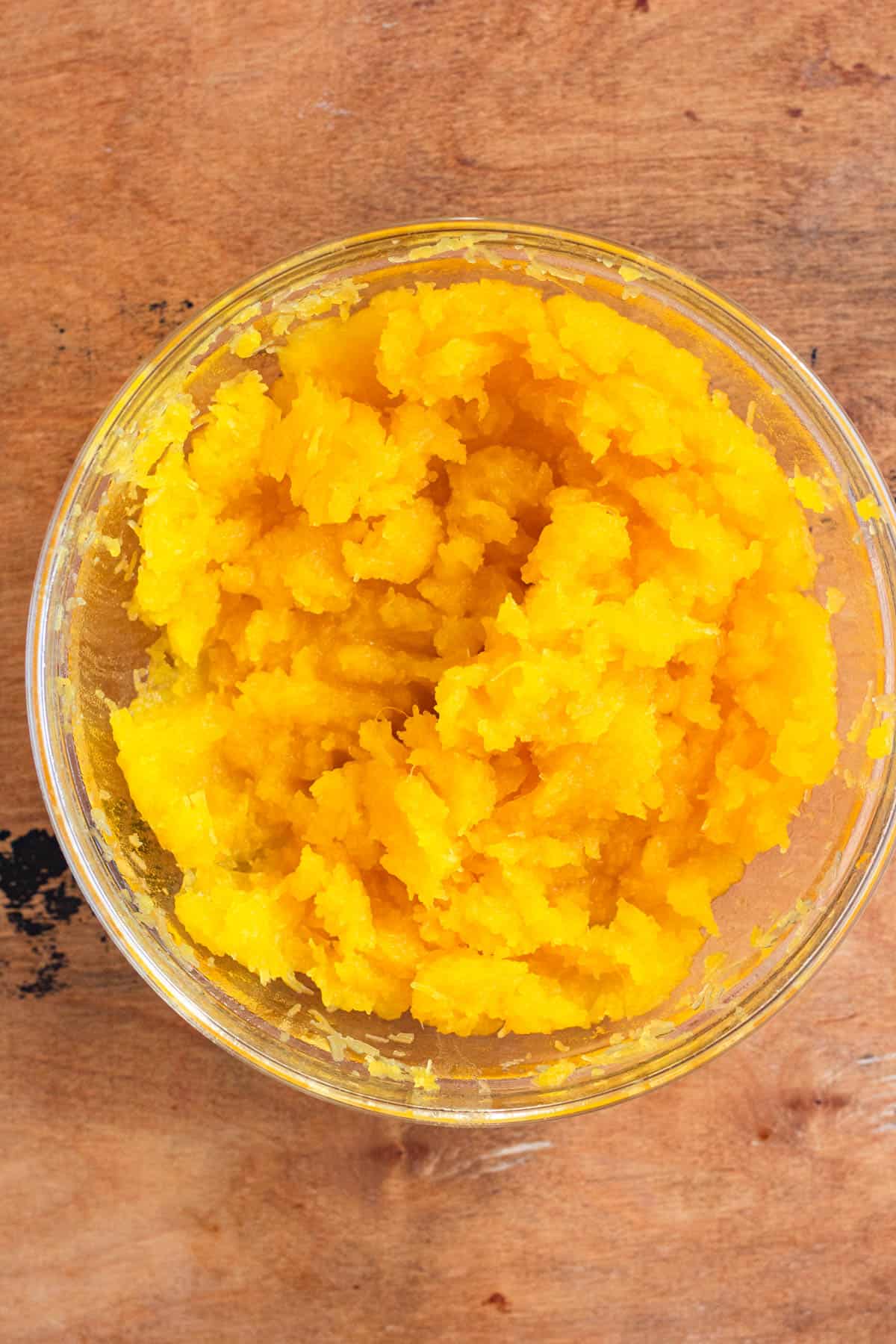 A bowl filled with smooth, mashed pumpkin.