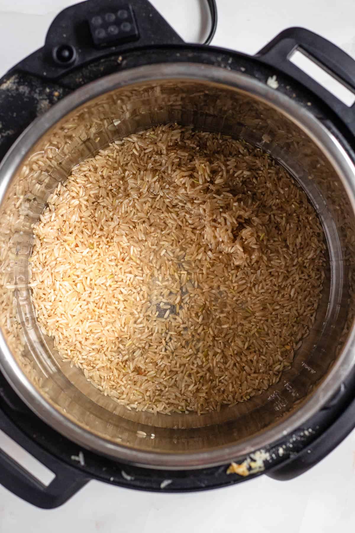 Brown rice and water placed into the Instant Pot, ready to cook. 