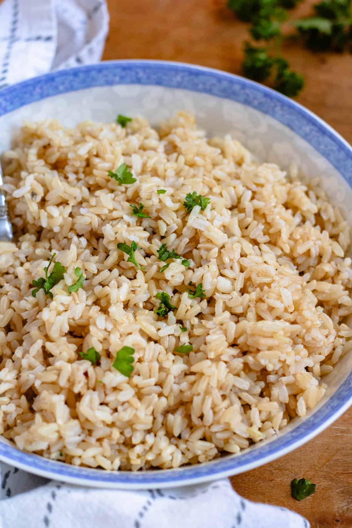 A plate filled with fluffy, cooked brown rice.