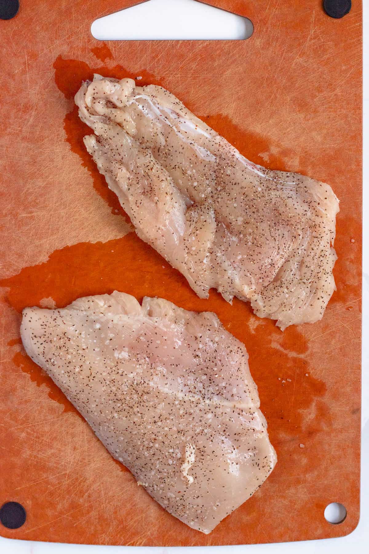 Chicken cutlets pounded thin and seasoned with salt and pepper.
