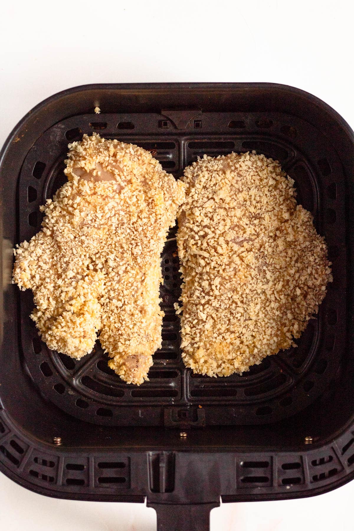 Chicken Katsu is cooked in the air fryer until golden and crispy on both sides.