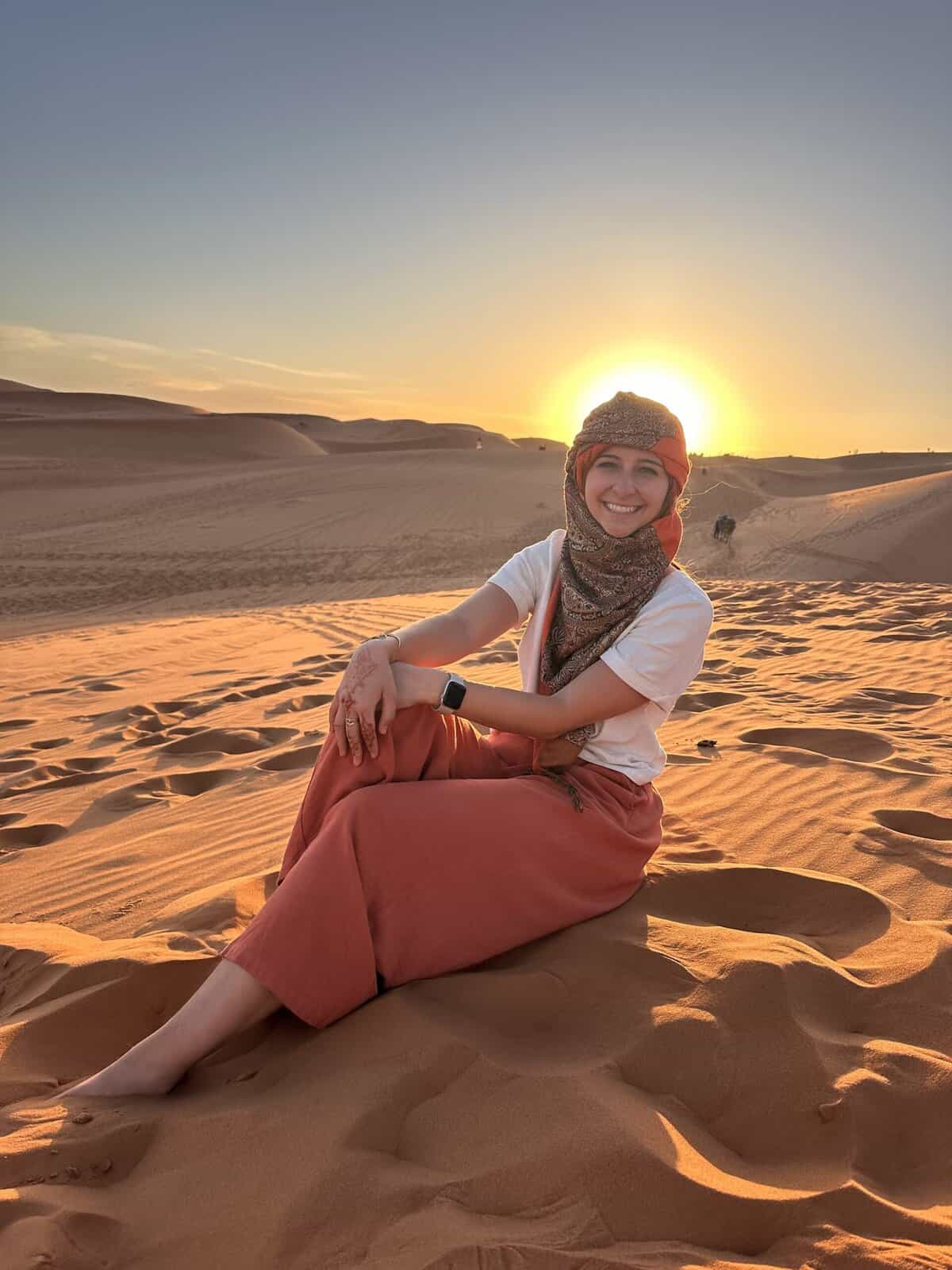 Girl during sunset in the sahara
