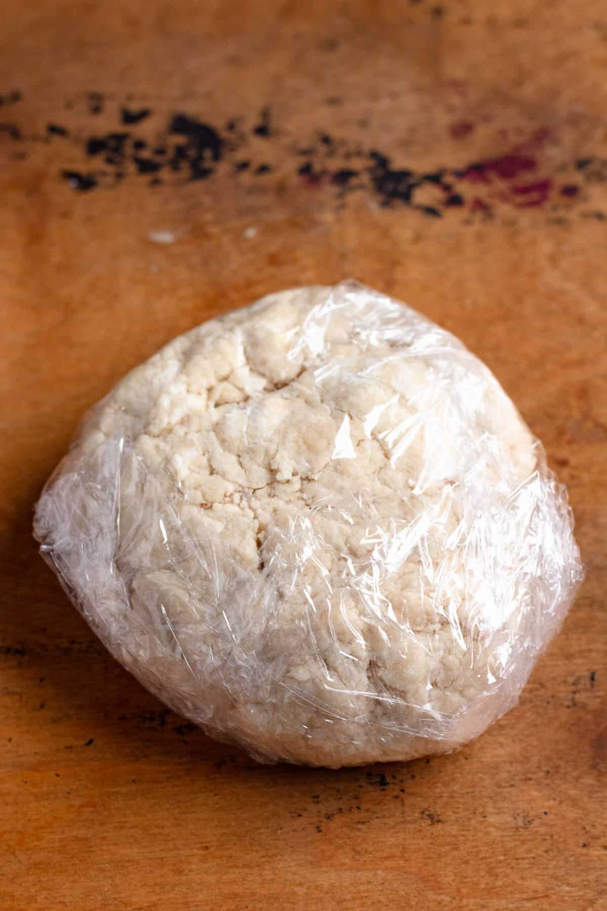 Dough wrapped in plastic wrap.