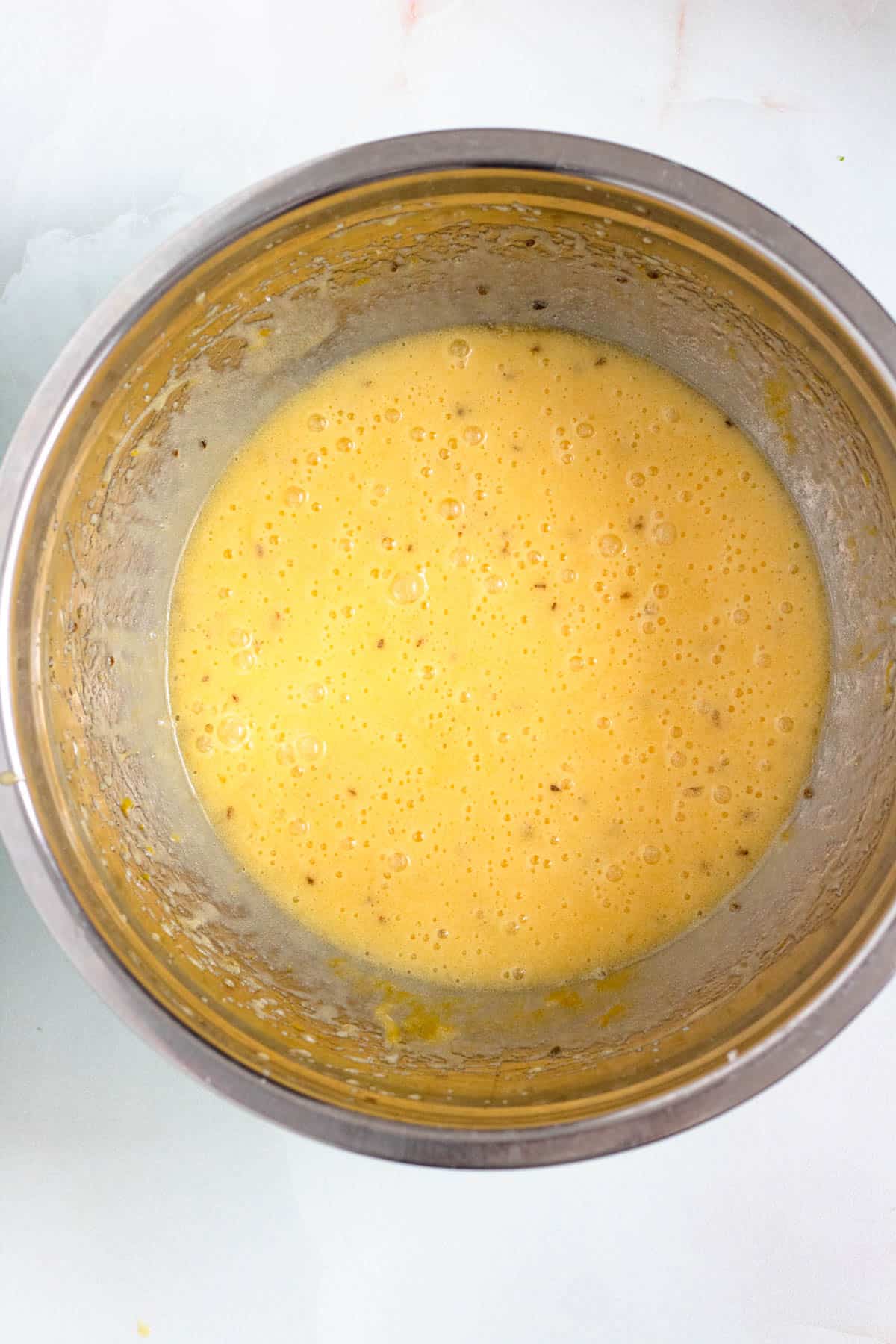 Melted butter and vanilla added to the bowl.