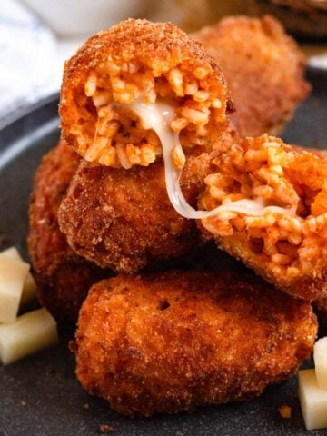 Crispy Roman fried rice balls stuffed with melted mozzarella.