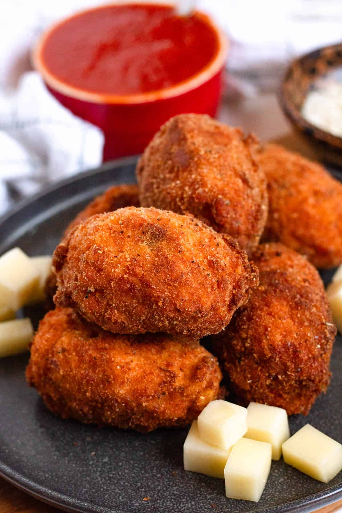 Crispy Supplì al Telefono served with mozzarella cubes.