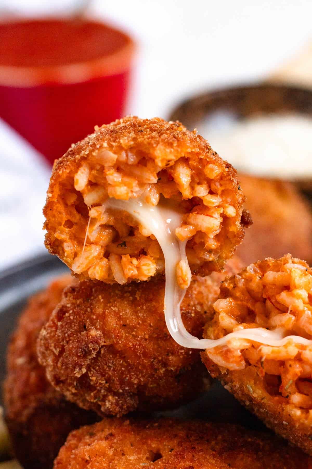 Supplì al Telefono with melted mozzarella stretching from the center.