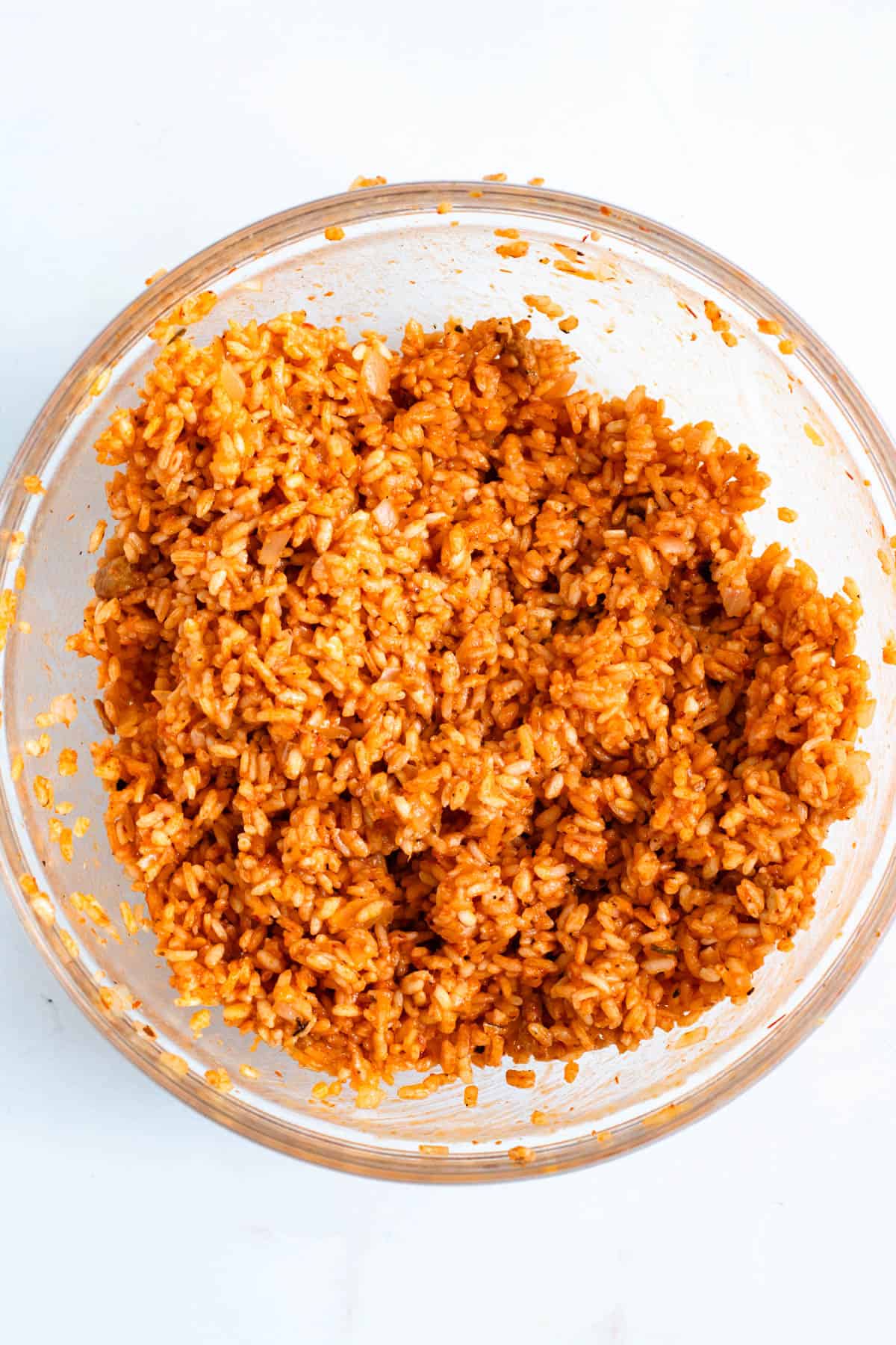 Cooked supplì rice in a glass bowl, ready to shape.