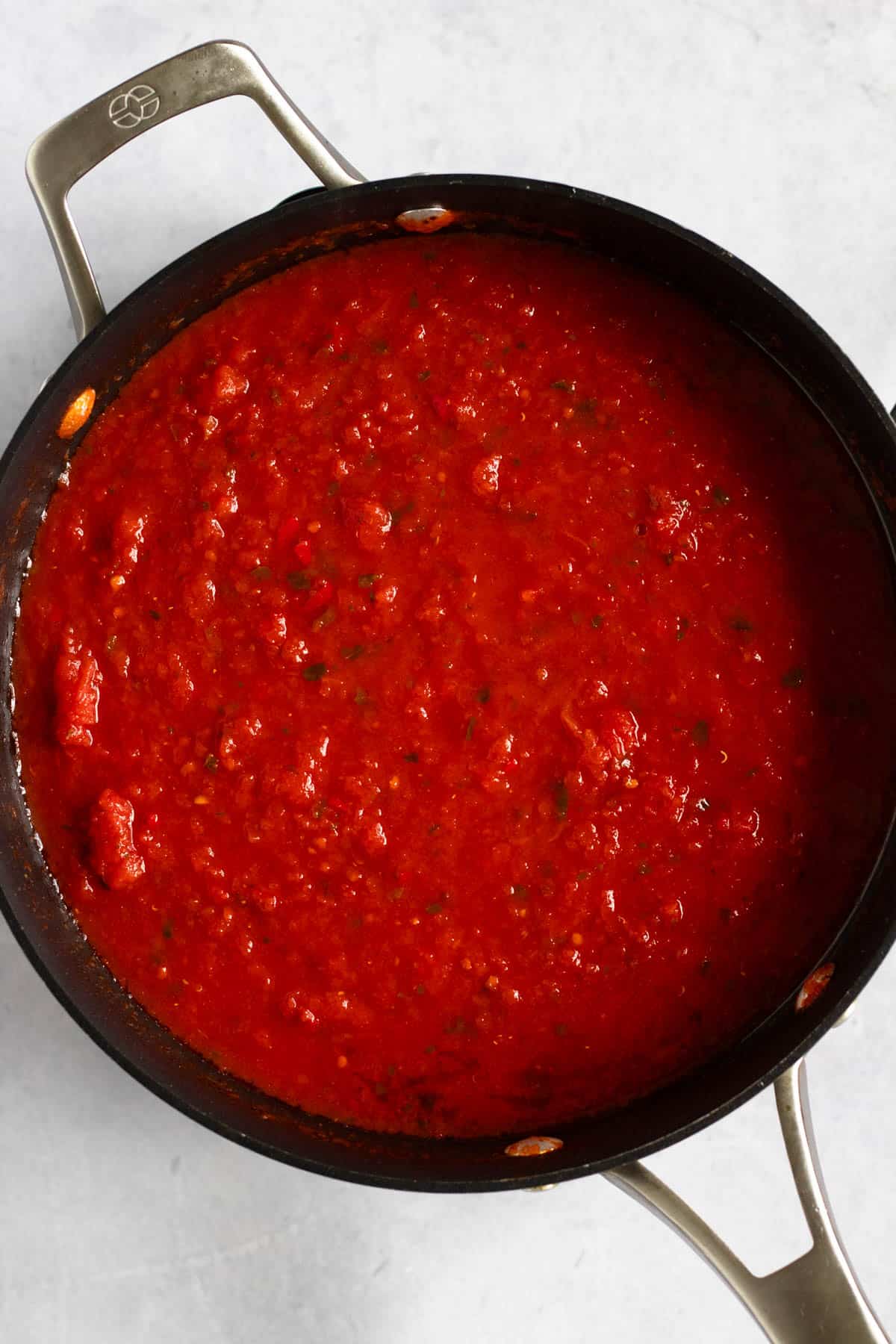 San Marzano tomato sauce simmering in a pan for Bucatini all’Amatriciana.