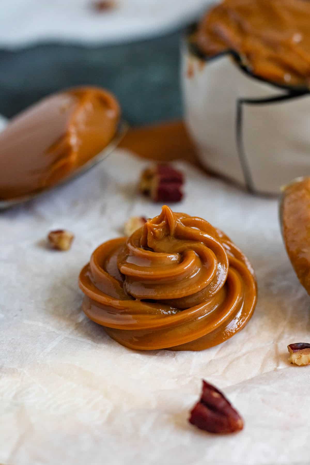 Homemade dulce de leche piped into a thick caramel swirl.