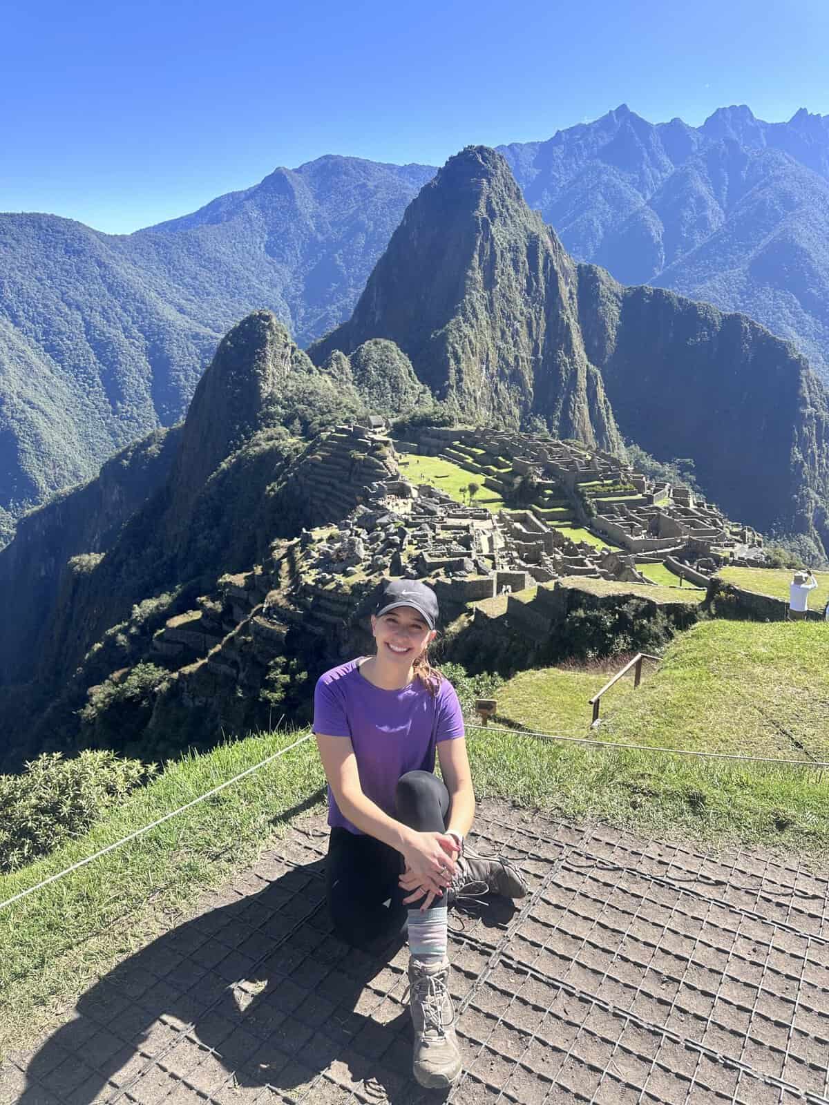 Alexandria sitting in front of Machu Picchu in Peru.