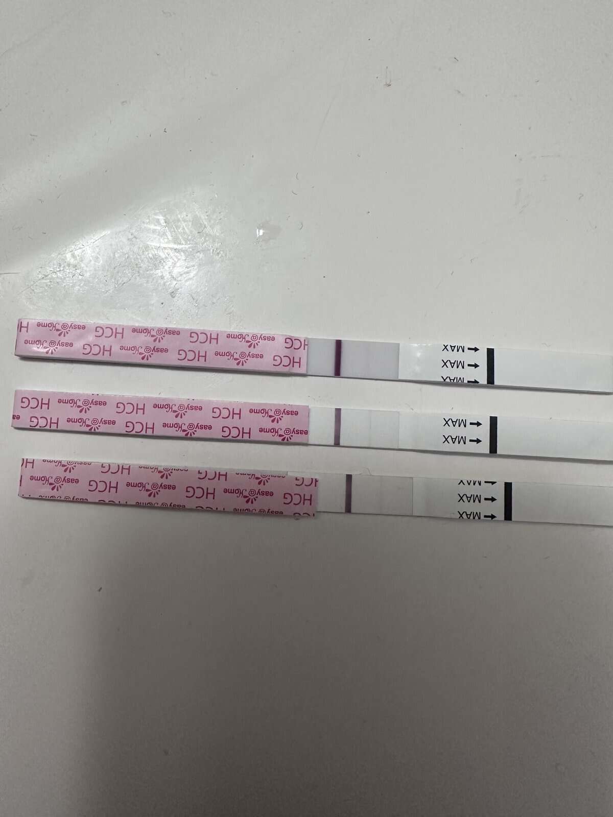 Three positive pregnancy tests. 