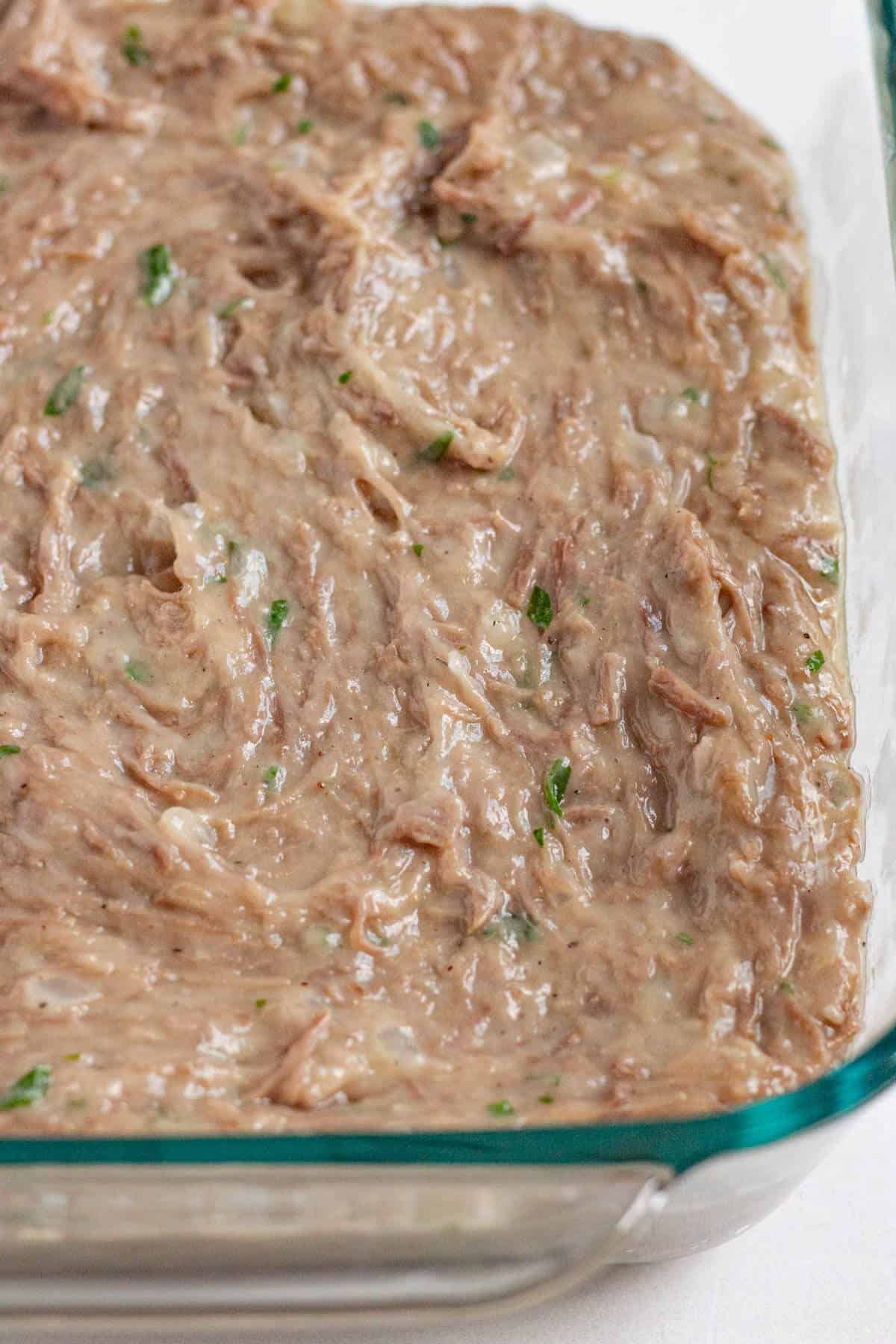 Bitterballen filling spread into a dish to chill until firm.