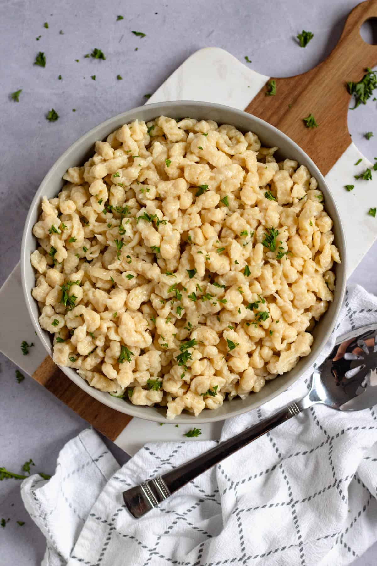 Easy German spaetzle topped with fresh parsley and ready to serve.